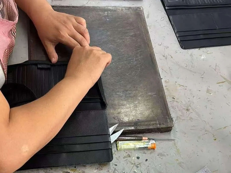 Que inspeções de qualidade a Godere realiza antes do envio da carteira?